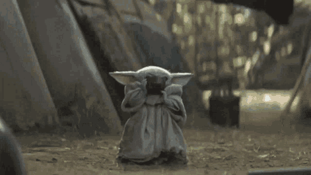 Baby Yoda calmly drinking soup