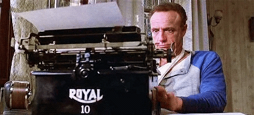 James Caan from film MISERY typing grimly on a typewriters