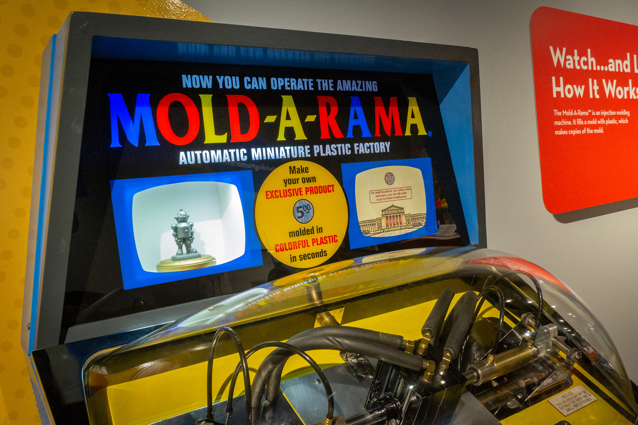 Angled view of a Mold-A-Rama molded injection souvenir machine