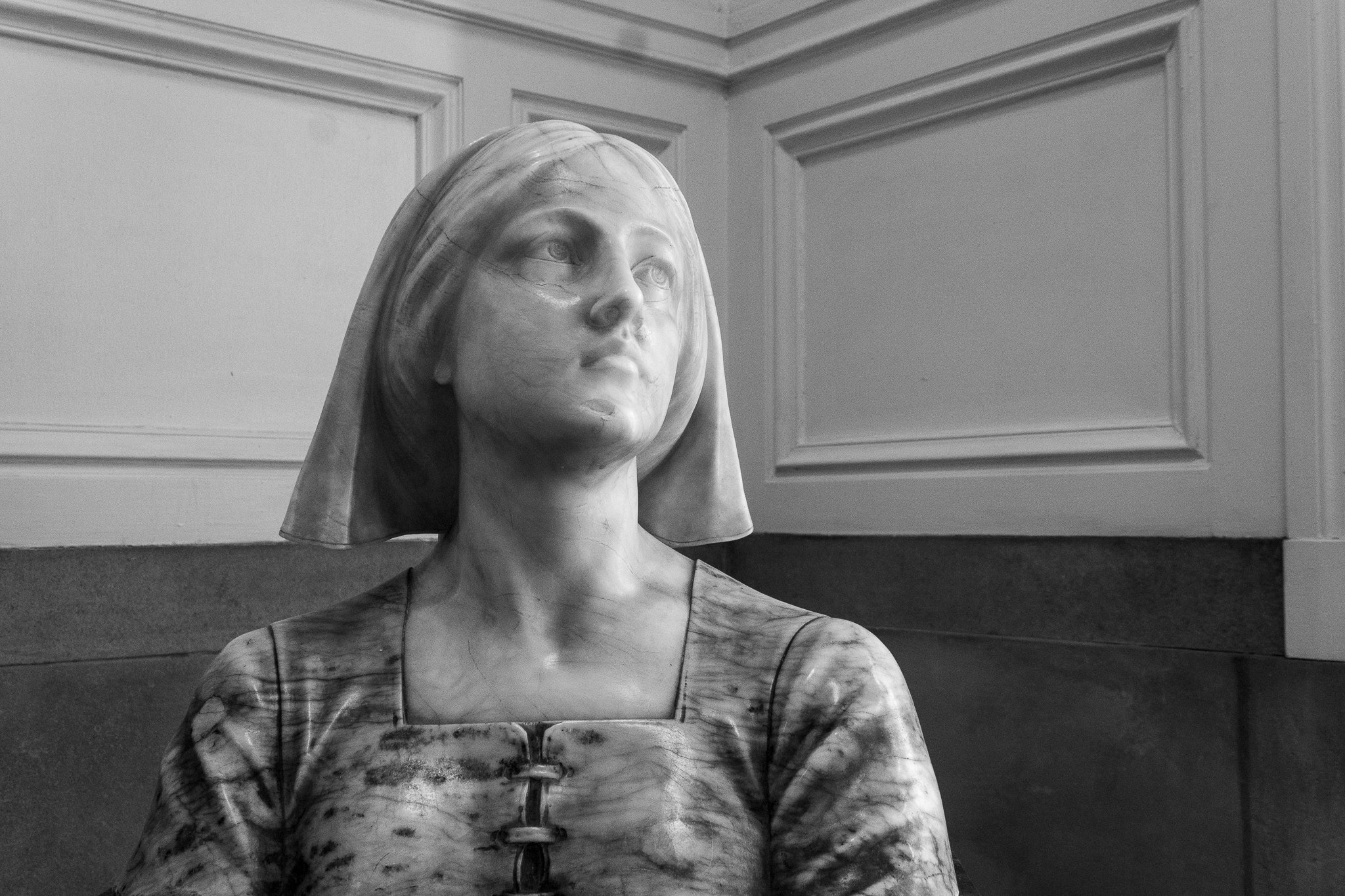 Marble bust of Florence Nightingale as a young woman in a nurse's uniform